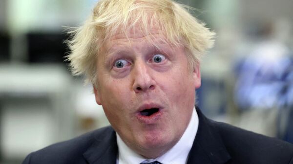 FILE PHOTO: Boris Johnson reacts during a visit to Thales weapons manufacturer in Belfast on May 16, 2022 - Sputnik International