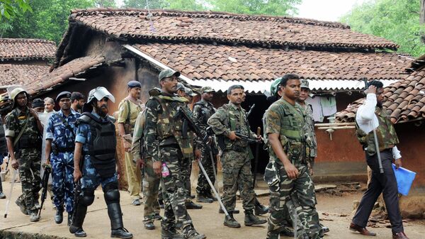 This photo taken on June 27, 2018 shows Indian security forces patrolling around Ghagra village in Khunti district in India's eastern Jharkhand state, following the kidnapping of three policemen - Sputnik International