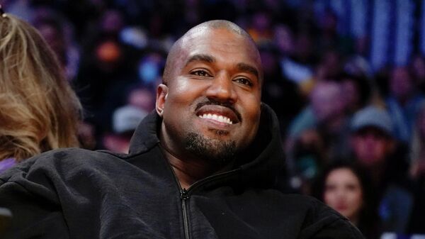 Kanye West watches the first half of an NBA basketball game between the Washington Wizards and the Los Angeles Lakers in Los Angeles on March 11, 2022. A completed documentary about the rapper formerly known as Kanye West has been shelved amid his recent slew of antisemitic remark - Sputnik International