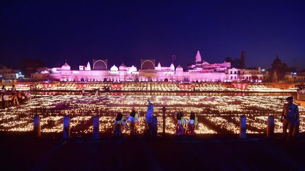 Devotees light earthen lamps on the banks of river Sarayu on the eve of Diwali, the Hindu festival of lights, in Ayodhya on October 23, 2022. - Sputnik International