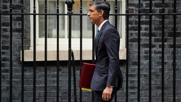 Britain's Prime Minister Rishi Sunak leaves 10 Downing Street in central London on October 26, 2022, for the House of Commons to take part in his first Prime Minister's Questions (PMQs) - Sputnik International