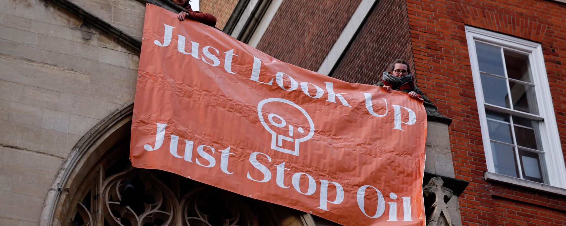 Activists from the Just Stop Oil campaign group protest against the use of oil after the arrivals for the BAFTA British Academy Film Awards at the Royal Albert Hall, in London, on March 13, 2022. - Sputnik International, 1920, 31.10.2022