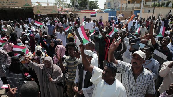 Dozens of people gather in front of the office of the United Nations Integrated Transition Assistance Mission in Sudan (UNITAMS) in support of Sudan's military leaders, in Khartoum, Sudan, Saturday, Oct. 29, 2022.  - Sputnik International