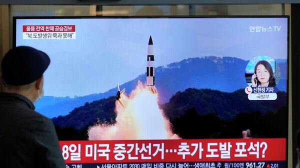 A TV screen shows a file image of North Korea's missile launch during a news program at the Seoul Railway Station in Seoul, South Korea, Wednesday, Nov. 2, 2022. South Korea says it has issued an air raid alert for residents on an island off its eastern coast after North Korea fired a few missiles toward the sea - Sputnik International