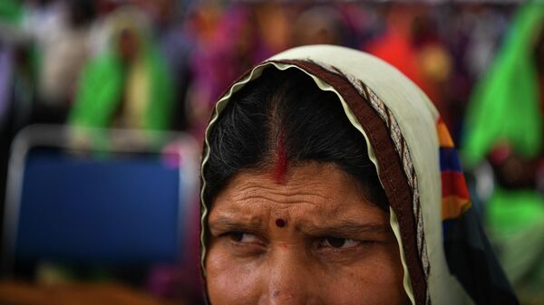An Indian participant of the 'Dignity March' looks on as she attends the culmination of the march at Ramleela Ground in New Delhi on February 22, 2019. - Sputnik International