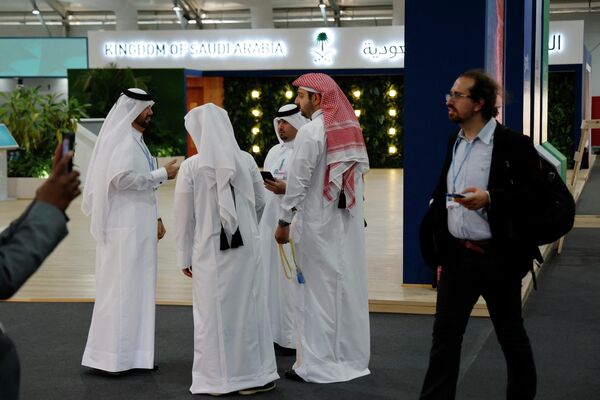 Participants gather in front of the Saudi stand inside the Sharm El Sheikh International Convention Centre, on the first day of the COP27 climate summit, in Egypt&#x27;s Red Sea resort city of Sharm el-Sheikh, on November 6, 2022. - Sputnik International