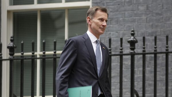 Britain's Chancellor Jeremy Hunt leaves 11 Downing Street to deliver his autumn financial statement to Parliament - Sputnik International
