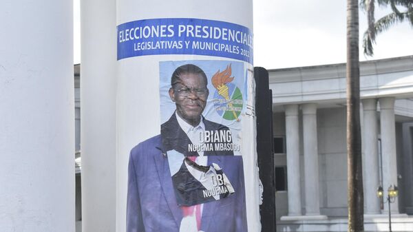 A campaign poster for for Equatorial Guinea President, Teodoro Obiang Nguema Mbasogo, is pated over a campaign poster of opponent Andres Esono Ondo of the Convergence for Social Democracy (CPDS),  in Malabo on November 17, 2022. - Sputnik International