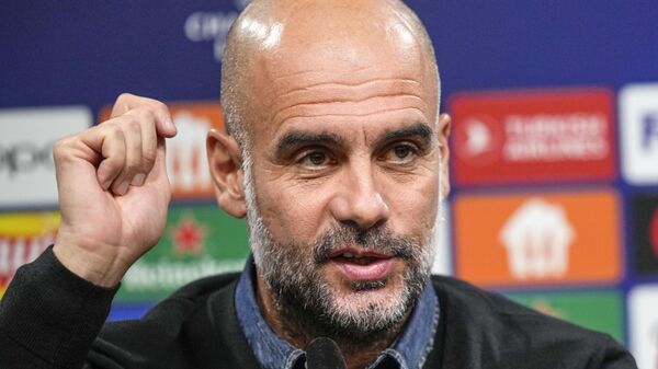 Manchester City's head coach Pep Guardiola talks to the media at a press conference prior the Champions League Group G soccer match between Borussia Dortmund and Manchester City in Dortmund, Germany, Monday, Oct. 24, 2022. - Sputnik International