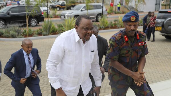 Kenya's former President Uhuru Kenyatta, center, arrives for Ethiopian peace talks in Nairobi, Kenya Saturday, Nov. 12, 2022 - Sputnik International