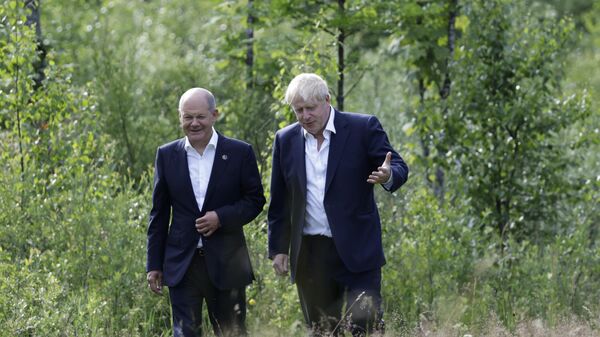 German Chancellor Olaf Scholz and British Prime Minister Boris Johnson walk during a bilateral meeting during the first day of the G7 leaders' summit at Bavaria's Schloss Elmau castle - Sputnik International