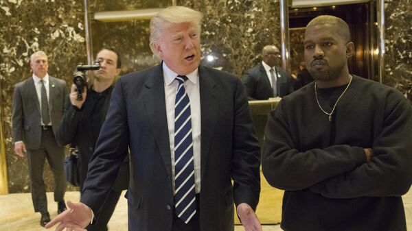 Donald Trump and Kanye West pose for a picture in the lobby of Trump Tower in New York, Tuesday, Dec. 13, 2016. - Sputnik International
