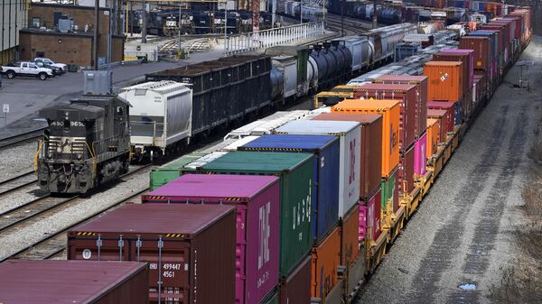This April 2, 2021, file photo shows freight train cars and containers at Norfolk Southern Railroad's Conway Yard in Conway, Pa.  - Sputnik International