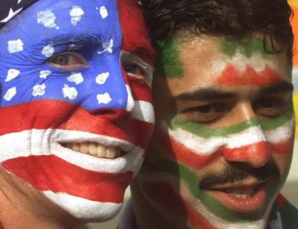 Four days before this fateful match, US Secretary of State Madeleine Albright proposed the establishment of bilateral relations between Iran and the United States.Above: Mike Moscrop, left, from Orange County, Calif., poses with Amir Sieidoust, an Iranian supporter living in Holland outside the Gerlain Stadium in Lyon on Sunday, June 21, 1998, before the start of the USA vs Iran World Cup soccer match. - Sputnik International