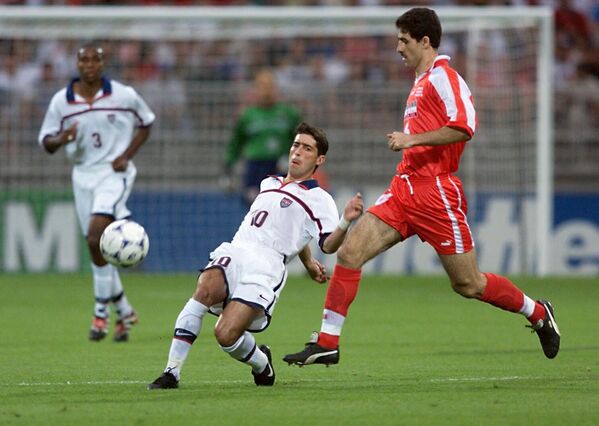 Some politicians in Iran called the match “an encounter with the Evil Empire.”Above: US midfielder Tab Ramos (C) is challenged by Iranian midfielder Karim Bagheri, as teammate Eddie Pope (L) looks on on June 21 at the Gerland stadium in Lyon, central France, during the 1998 World Cup Group F  match between Iran and the United States. - Sputnik International