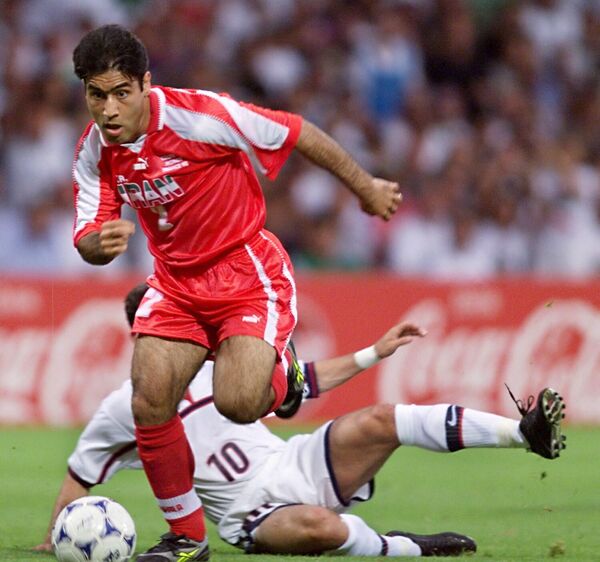 Mehdi Mahdavikia&#x27;s winning goal was named in Iran as the “goal of the century.”Above: Iranian midfielder Mehdi Mahdavikia runs on the field with the ball despite a tackle by US midfielder Tab Ramos (on the ground), June 21 at the Gerland stadium in Lyon, central France, during the 1998 Soccer World Cup Group F first round match between Iran and the United States.  - Sputnik International