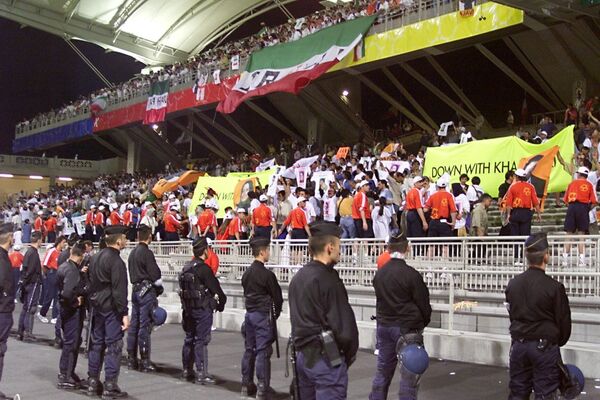 To prevent riots in the stands, match organizers had to take unprecedented security measures.Above: Security forces are posted in front of the stands as some Iranian opponents demonstrate at Gerland stadium on June 21 during the 1998 World Cup Group F first round match in Lyon, central France, between Iran and the United States. Iran won 2-1.  - Sputnik International