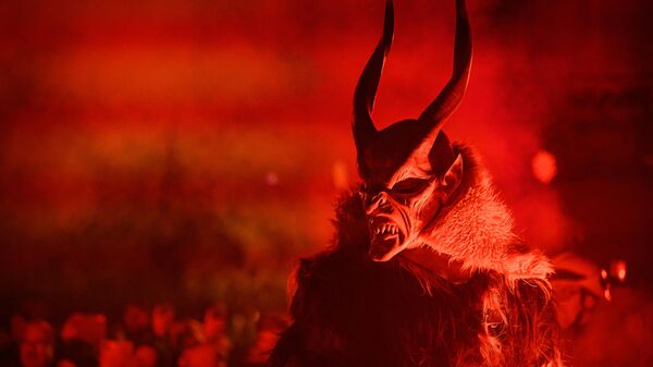 A participant dressed as Krampus, a half-goat, half-demon figure that punishes people who misbehaved during the Christmas season - Sputnik International