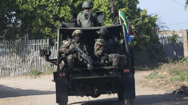 A military convoy of South Africa National Defence Forces (SANDF) rides along a dirt road in the Maringanha district in Pemba on August 5, 2021.  - Sputnik International