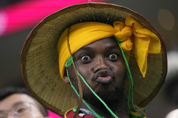 A Senegal fan cheers during the World Cup round of 16 soccer match between England and Senegal, at the Al Bayt Stadium in Al Khor, Qatar on Sunday, December 4, 2022. - Sputnik International