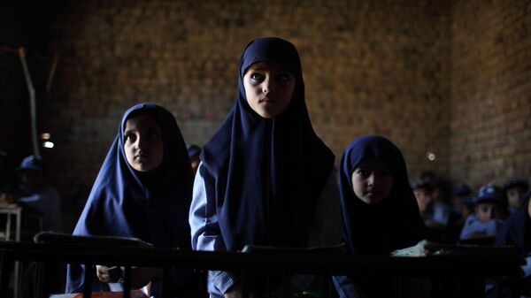 In this photo taken on Tuesday, Oct. 13, 2009, children attend a class in a school in Qutbal, Pakistan. - Sputnik International