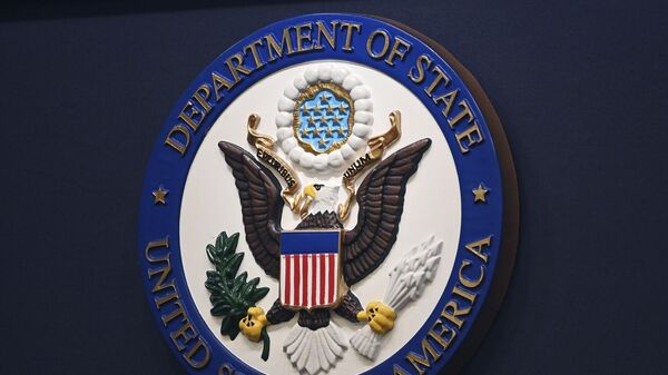 The State Department seal is seen on the briefing room lectern ahead of a briefing by State Department spokesperson Ned Price at the State Department in Washington, Monday, Janu 31, 2022. - Sputnik International