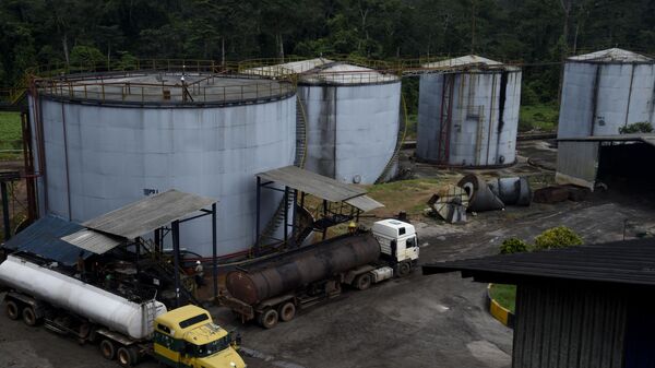 Tankers load crude palm oil at Okomu Oil Mills, Okomu community in Edo State, midwestern Nigeria, on September 14, 2021. - Sputnik International