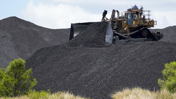 Heavy machinery moves coal at a mine near Muswellbrook in the Hunter Valley, Australia, Tuesday, Nov. 2, 2021.  - Sputnik International
