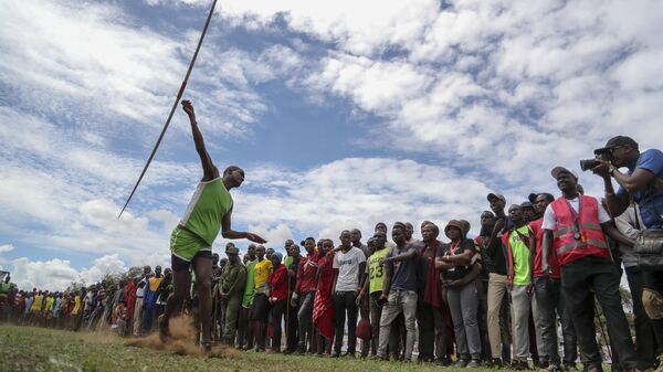 A Maasai man throws a javelin as he competes in the Maasai Olympics in Kimana Sanctuary, southern Kenya Saturday, Dec. 10, 2022. - Sputnik International