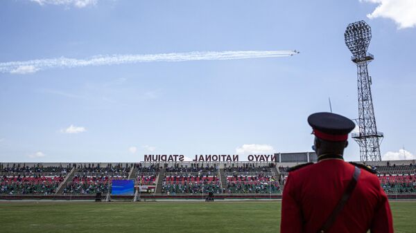 A Kenyan soldier watches as Kenyan Air Force planes do a fly over Nyayo National Stadium during the Independence Day ceremony, called Jamhuri Day (“Republic” in Swahili) in Nairobi, Kenya, on December 12, 2020. - Sputnik International
