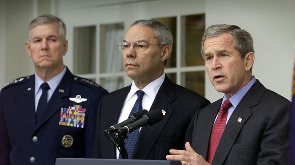 US President George W. Bush (R) is joined by Secretary of State Colin Powell (C) and Joint Chiefs of Staff General Richard Myers (R) as he announces the US intention to withdraw from the 1972 Antiballistic Missile Treaty in a Rose Garden ceremony at the White House 13 December 2001.  - Sputnik International