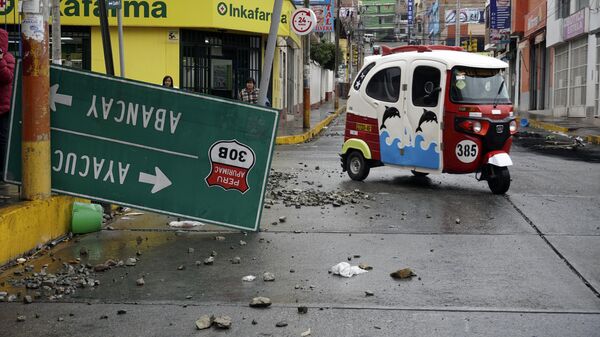 A road sign lays in the street the day after protests that called for the closure of Congress, the resignation of the new President Dina Boluarte and for general elections in Andahuaylas, Peru, Tuesday, Dec. 13, 2022. Peru's President Pedro Castillo was detained on Dec. 7 after he was ousted by lawmakers when he sought to dissolve Congress ahead of an impeachment vote.  - Sputnik International