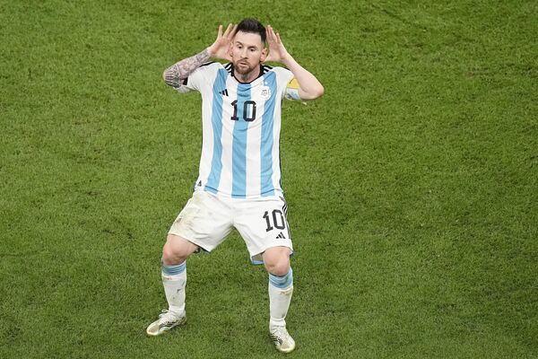 Argentina&#x27;s Lionel Messi celebrates after scoring during the World Cup quarterfinal between the Netherlands and Argentina at the Lusail Stadium in Lusail, Qatar, Friday, December 9, 2022. - Sputnik International