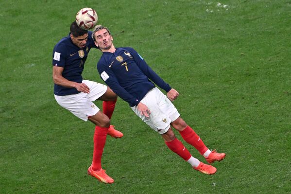 France&#x27;s footballers Raphael Varane and Antoine Griezmann (right) playing in the FIFA World Cup semi-final match between France and Morocco. - Sputnik International