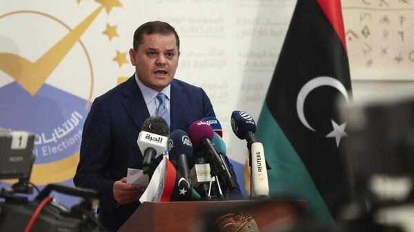 Libya's Interim Prime Minister Abdulhamid Dbeibah speaks after registering his candidacy for next month's presidential election on November 21, 2021 in the capital Tripoli. - Sputnik International