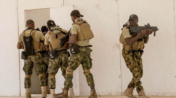 In this Feb. 18, 2020, photo, Nigerian Navy Special Boat Service troops exercise under the supervision of British special forces during U.S. military-led annual counterterrorism exercise in Thies, Senegal. - Sputnik International