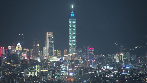 This picture taken from the Kuanyin Mountain shows its view of Taipei 101, a 508-meter commercial building, surrounding by Taipei and New Taipei City on July 22, 2022. - Sputnik International