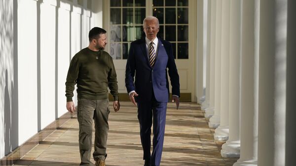 President Joe Biden and Ukrainian President Volodymyr Zelenskyy walk along the Colonnade of the White House, Wednesday, Dec. 21, 2022, in Washington.  - Sputnik International