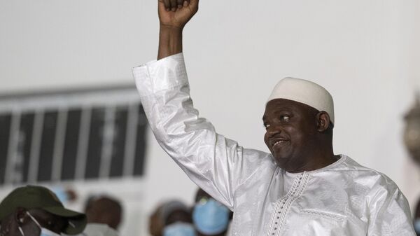 Gambian President Adama Barrow celebrates after winning the presidential election in Banjul, Gambia, Sunday, Dec. 5, 2021.  - Sputnik International