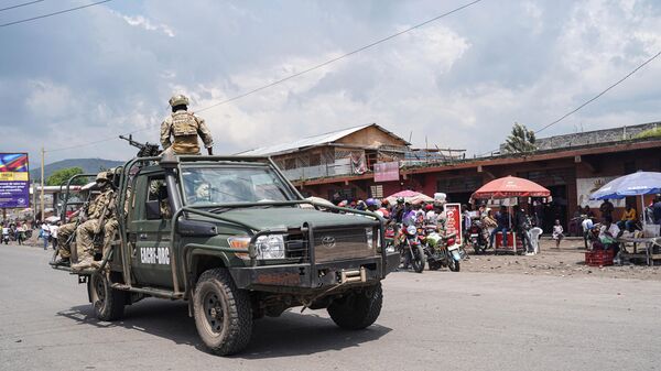 East African Community (EAC) force soldiers drive on a vehicle in Goma, eastern Democratic Republic of Congo, on December 2, 2022 - Sputnik International