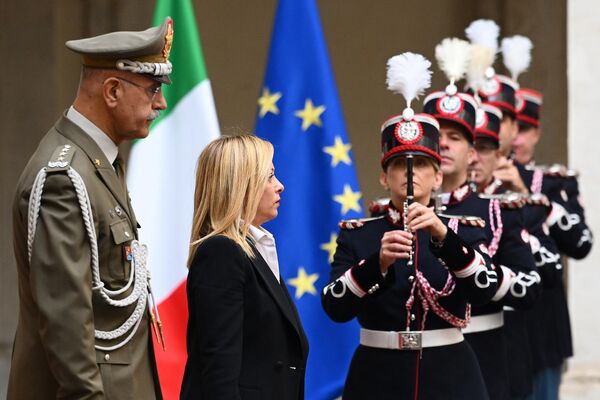 Italy&#x27;s new prime minister, Giorgia Meloni arrives for a handover ceremony at Palazzo Chigi in Rome on October 23, 2022. Far-right leader Giorgia Meloni was named Italian prime minister on October 21, 2022 after her party&#x27;s historic election win, becoming the first woman to head a government in Italy. - Sputnik International
