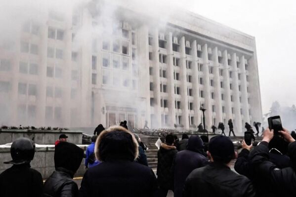 A frame grab taken on January 6, 2022, from an AFPTV video made on January 5, 2022, shows protesters storming in the city hall of Kazakhstan&#x27;s largest city Almaty as unprecedented unrest in the Central Asian nation spun out of control due to a hike in energy prices. Protestors took gear and tear gas from police officers during a demonstration in the streets of Almaty that caused the death of twelve security officers and wounded 353 people, media reports said on January 6. Long seen as one of the most stable of the ex-Soviet republics of Central Asia, energy-rich Kazakhstan is facing its biggest crisis in decades after days of protests over rising fuel prices escalated into widespread unrest. - Sputnik International
