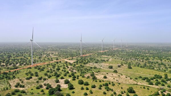 This picture taken on October 23, 2019, shows wind turbines of the Senegal’s first utility-scale wind farm of Taiba Ndiaye (Parc Eolien Taiba Ndiaye in French or PETN), near the Taiba N'Diaye community in western Senegal.  - Sputnik International