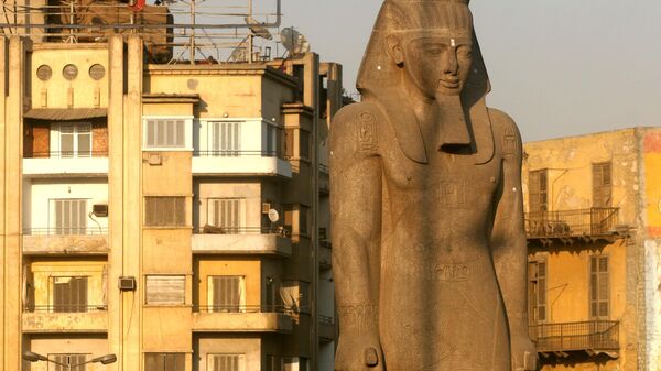 ** FILE ** The Pharaoh Ramses II statue, suffering from the ravages of pollution, stands in downtown Cairo, in this June 28, 2006 file photo. - Sputnik International