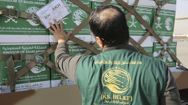 In this Thursday, Feb. 1, 2018 photograph, Fahad al-Osemy, the director of urgent aid at the King Salman Humanitarian Aid and Relief Center, prepares an aid flight for Yemen in Riyadh, Saudi Arabia. Saudi Arabia, which is at war with the Shiite rebels who hold Yemen's capital, is also delivering aid to the Arab world's poorest country. - Sputnik International