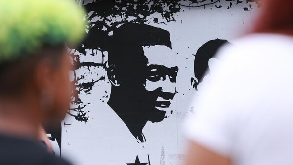 Fans of soccer star Pele walk past mural with an image of the player outside the Vila Belmiro stadium in Santos, Brazil, Thursday, Dec. 29, 2022. Pele, the Brazilian king of soccer who won a record three World Cups and became one of the most commanding sports figures of the last century, died in Sao Paulo. He was 82. - Sputnik International