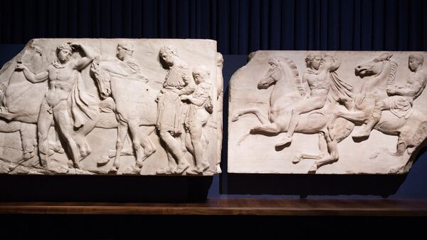 Two sections of marble frieze sculptures (438-432 BC) from the Parthenon in Athens, part of the collection referred to as the Elgin Marbles, are displayed in central London on March 24, 2015.  - Sputnik International