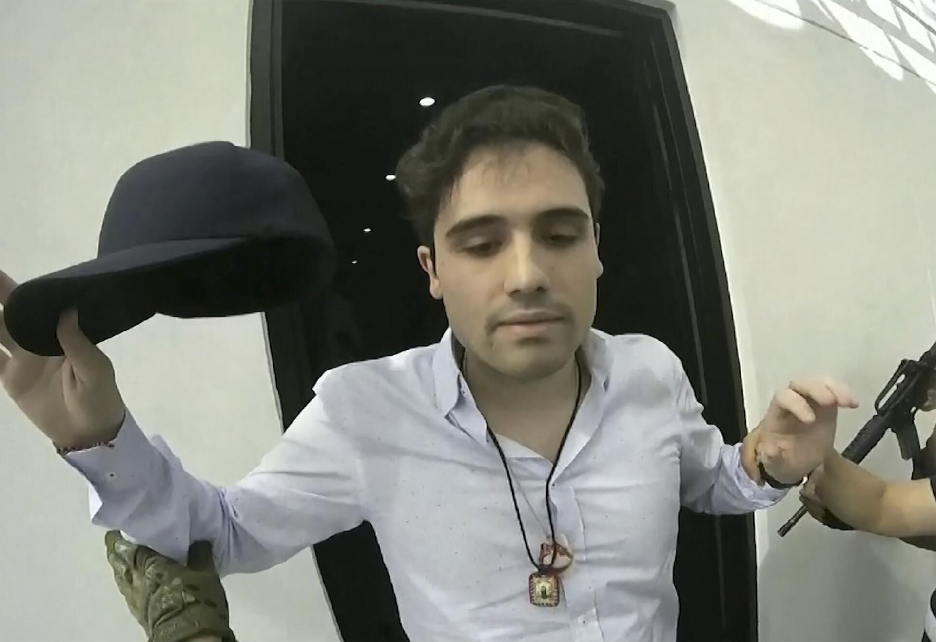 FILE - On October 17, 2019, a video fragment provided by the Mexican government shows Ovidio Guzmán López at the time of his arrest, in Culiacan, Mexico. Mexican security forces were forced to release the son of Sinaloa cartel leader Joaquin El Chapo Guzman that day after a shootout in the western city of Culiacan. - Sputnik International, 1920, 06.01.2023