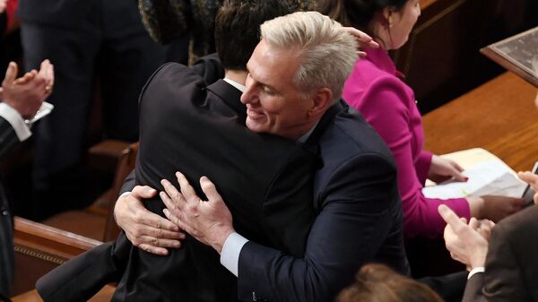 Newly elected Speaker of the US House of Representatives  Kevin McCarthy hugs his Floor Director John Leganski after being annointed on the 15th round of voting at the US Capitol in Washington, DC, on January 7, 2023. - Sputnik International