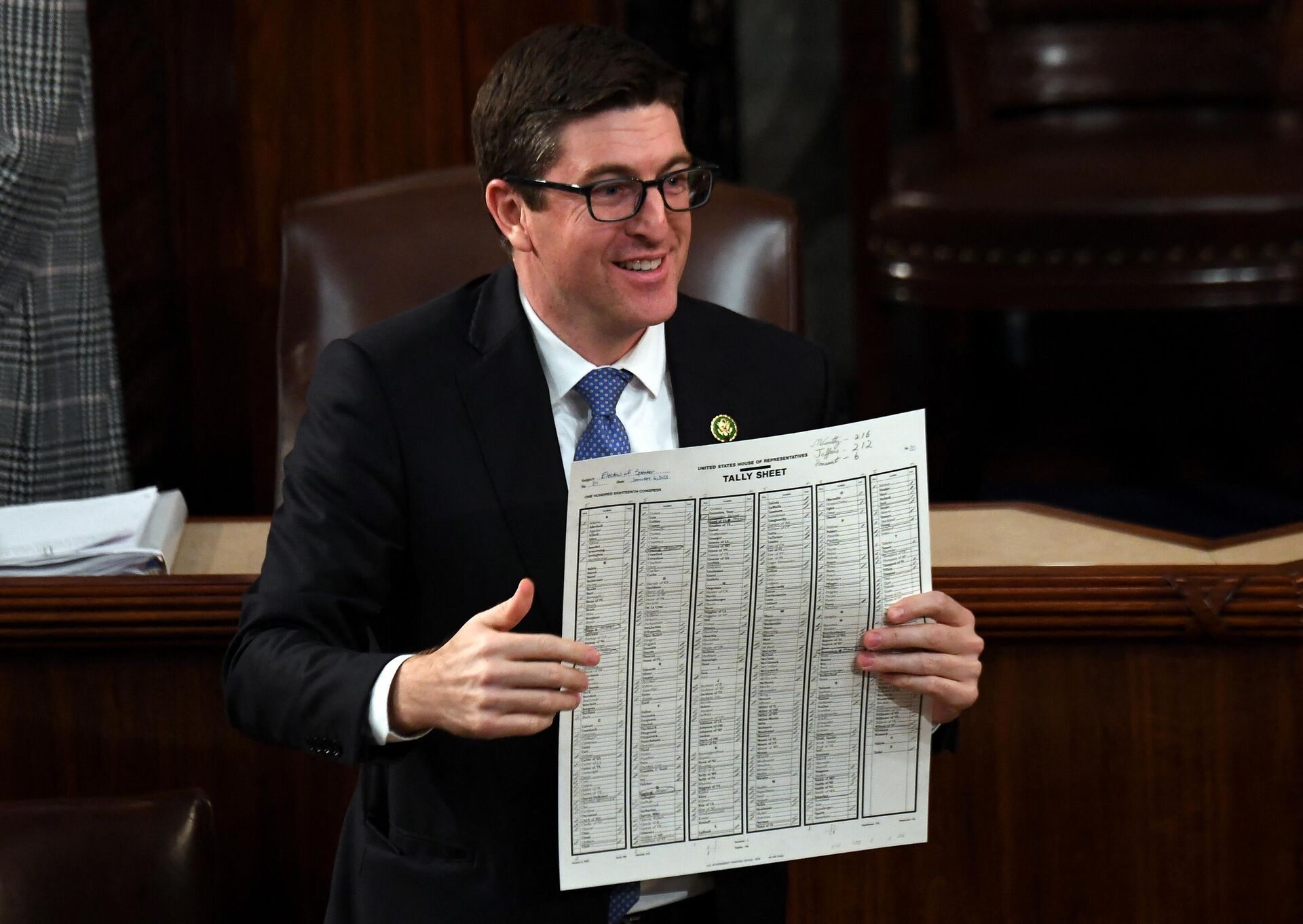 Representative  Bryan Steil holds the tally of the votes for Newly elected Speaker of the House Kevin McCarthy after the 15th round of voting at the US Capitol in Washington, DC, on January 7, 2023.  - Sputnik International, 1920, 07.01.2023
